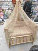 تصویر گهواره کنار مادر چوبی 