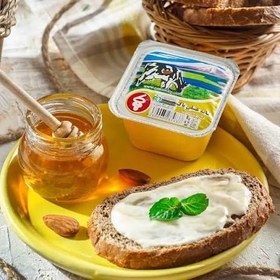 تصویر خامه تک نفره پاک خامه ۱۰۰ گرمی با طعم عسل شکلات و ساده