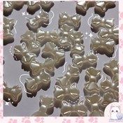 تصویر مهره پاپیون صدفی 