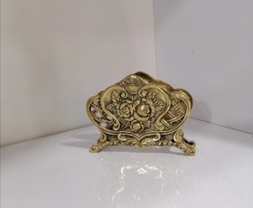 تصویر جادستمال کاغذی کنار سینی برنز Paper napkin holder next to the bronze tray