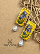 تصویر گوشواره زنانه مدل زنبق بنفش 