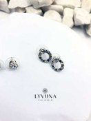 تصویر گوشواره نقره‌ای شاخه گل و حلقه 