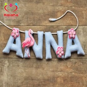 تصویر آویز نام کودک هیاهو مدل Flamingo 