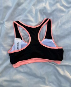 تصویر نیم تنه زنانه مدل پشت قهرمان رنگ مشکی نارنجی 