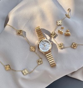 تصویر ساعت کوشی طلایی و آیتم های ست 