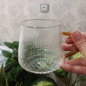 تصویر لیوان پیرکس دسته طلایی مدل طره ای الماسی 