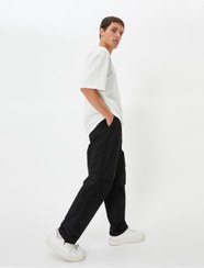تصویر شلوار گشاد چتر نجات، جیب دور کمر توری با جزئیات فاق نرمال راسته مردانه | کوتون Koton TYCAGE6T2N170292976305389 