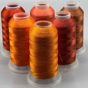 تصویر نخ های گلدوزی با چرخ ترک طیف نارنجی 