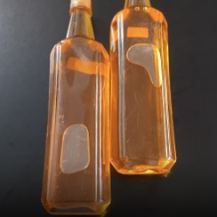 تصویر خرید روغن کنجد اصل پرس سرد | روغن کنجد خوراکی دارویی | تقویت پوست و مو | طلای مایع طب سنتی | با گارانتی کیفیت - نیم لیتر Buy original cold-pressed sesame oil | Edible medicinal sesame oil | Strengthen skin and hair | Liquid gold of traditional medicine | With quality guarantee