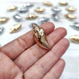 تصویر دکمه دفرمه طرح گوش ماهی 