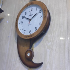 تصویر ساعت دیواری سیکو چوبی طرح بته جقه 