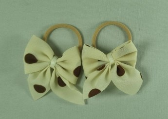 تصویر کش مو دخترانه پاپیونی خالدار 