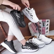 تصویر کتانی زنانه ریباک مدل طبی رنگ سفید مشکی با جنس فابیلاک 