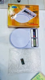 تصویر ترازوگرمی کارتن زرد 