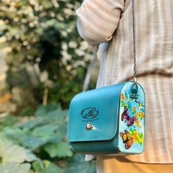 تصویر کیف رودوشی طرح پروانه چرم طبیعی گاوی رنگ آبی فیروزه ای 