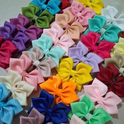 تصویر گل سر شش پر در رنگبندی مختلف روبان گروگرن 