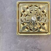 تصویر کفشور طلایی سوپاپ دار طرح گل 