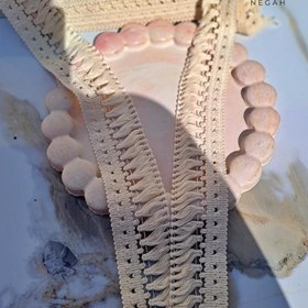 تصویر نوار ریشه کنفی رنگ کرم برای لباس 