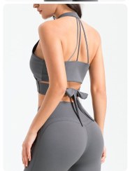 تصویر ست ورزشی زنانه اینفینیتی نیمتنه پشت پاپیونی + لگ بوتکات اسپندکس – وارداتی (S/M/L) - کرم / 
