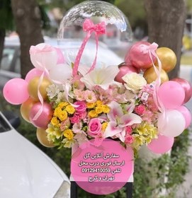 تصویر دسته گل و کیک تولد برای نوزاد با تزیین گیفت 