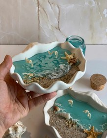 تصویر شمع دریایی با ظرف صدف 