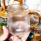 تصویر لیوان پیرکس شیاردار دسته طلایی ۲۶۰ میل 