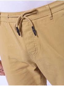 تصویر شلوار جین مردانه کژوال باریک فیت رنگ بژ برند the indian garage co Beige Men Slim Fit Casual Solid Regular Joggers