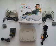 تصویر کنسول بازی سونی پلی استیشن 1 اسلیم استوک - دستگاه با دو دسته بدون شوک Sony PlayStation 1 Slim Stock Game Console