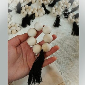 تصویر حلقه دستمال چوبی _کنفی 