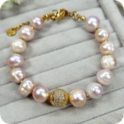 تصویر مروارید پرورشی گلبهی و گوی سواروسکی 