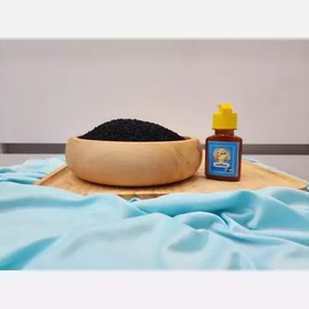 تصویر روغن سیاهدانه درجه یک بدون پایه روغن و با دستگاه روغن گیری 