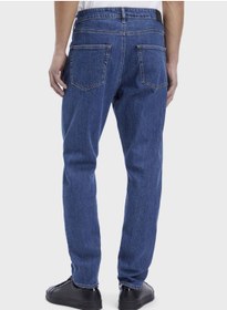 تصویر شلوار جین فیت باریک با رنگ شست‌وشو متوسط برند Calvin Klein Mid Wash Tapered Fit Jeans