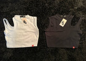 تصویر تاپ ریگولار نایک سفید و مشکی 