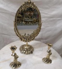 تصویر آینه وشمعدان برنز Bronze candlestick mirror. مرآة شمعدان برونزیة