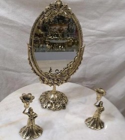 تصویر آینه وشمعدان برنز Bronze candlestick mirror. مرآة شمعدان برونزیة