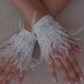 تصویر مچ بند دانتل و پر 