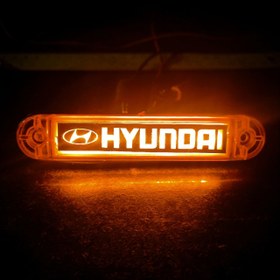 تصویر چراغ بغل 204 ، رنگ نارنجی آرم دار مدل هیوندای Hyundai ولتاژ کاری 24 ولت ضد آب مناسب نصب بر روی انواع کامیون و خاور طول 13 سانتیمتر 