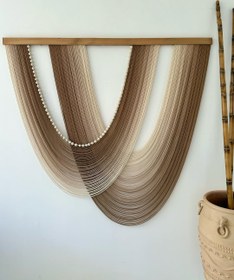 تصویر بوم ریس دو هلالی طیف کرم تا قهوه ای 