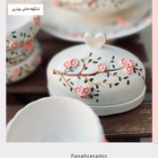 تصویر کره‌خوری سرامیکی دست‌ساز طرح گل‌های بهاری 