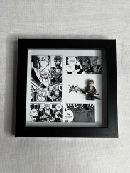 تصویر تابلو لگو اکشن فیگور رورونوآ زورو و صفحه مانگا 