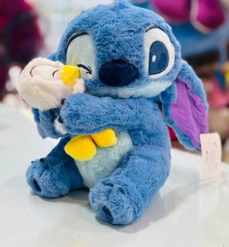 تصویر استيچ عروسك به دست 