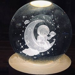 تصویر چراغ خواب گوی کریستالی طرح فضانورد و ماه سایز ۸ سانتیمتر 