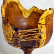 تصویر آجیل خوری پایه دار دفرمه از چوب سنجد 