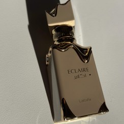 تصویر عطر ادوپرفیوم زنانه لطافه اکلایر حجم ۱۰ میل شیرین گرم 