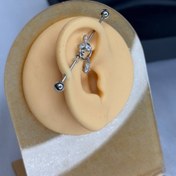 تصویر پیرسینگ محوری گوش طرح الماسی و اویزدار مجلسی 