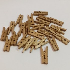 تصویر گیره چوبی رنگ طلایی کوچک بسته 20 عددی 