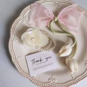 تصویر کش مرواریدی گلدار 