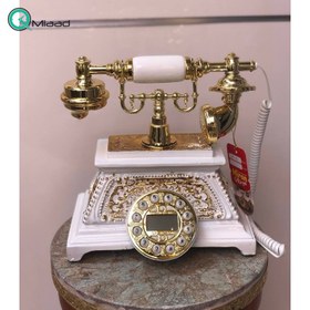 تصویر تلفن رومیزی سلطنتی میرون مدل 135، تلفن رومیزی سلطنتی دارای شناسه تماس گیرنده و شماره گیر دکمه ای، رنگ سفید طلایی 