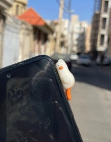 تصویر چسبونک گوشی و لپ تاپ مدل اردک شب تاب 