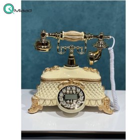 تصویر تلفن رومیزی سلطنتی میرون مدل 111، تلفن رومیزی سلطنتی دارای شناسه تماس گیرنده و شماره گیر دکمه ای، رنگ سفید طلایی 